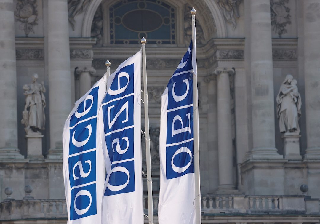 Flags of the Organisation for Security and Cooperation in Europe (OSCE) are pictured outside their headquarters in Vienna, Austria February 15, 2022. 