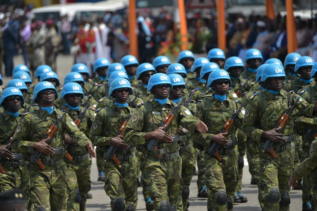 Ivorian soldiers of the UN peacekeeping mission in Mali MINUSMA (United Nations Multidimensional Integrated Stabilisation Mission in Mali) parade as they take part in the celebrations marking the 59th anniversary of Ivory Coast's independence from France, in Abidjan