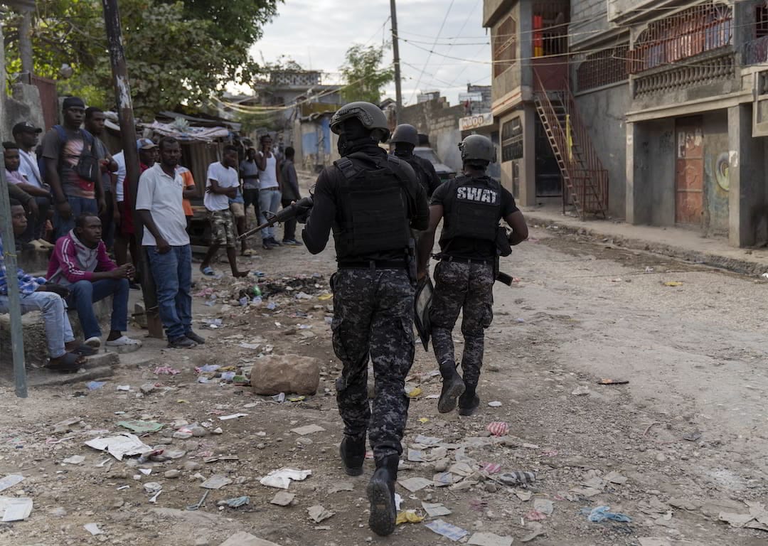 Police search the area during an attack by armed gangs in the Carrefour Feuille neighbourhood of Port-au-Prince, Haiti, November 10, 2022.