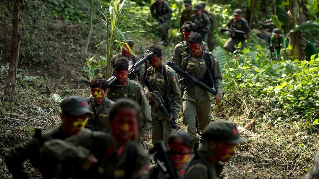 This photo taken on July 30, 2017 shows guerrillas of the New People's Army (NPA) marching in the Sierra Madre mountain range, located east of Manila. Fuelled by one of the world's starkest rich-poor divides, a Maoist rebellion that began months before the first human landed on the moon plods on even though the country now boasts one of the world's fastest-growing economies. Noel CELIS / AFP