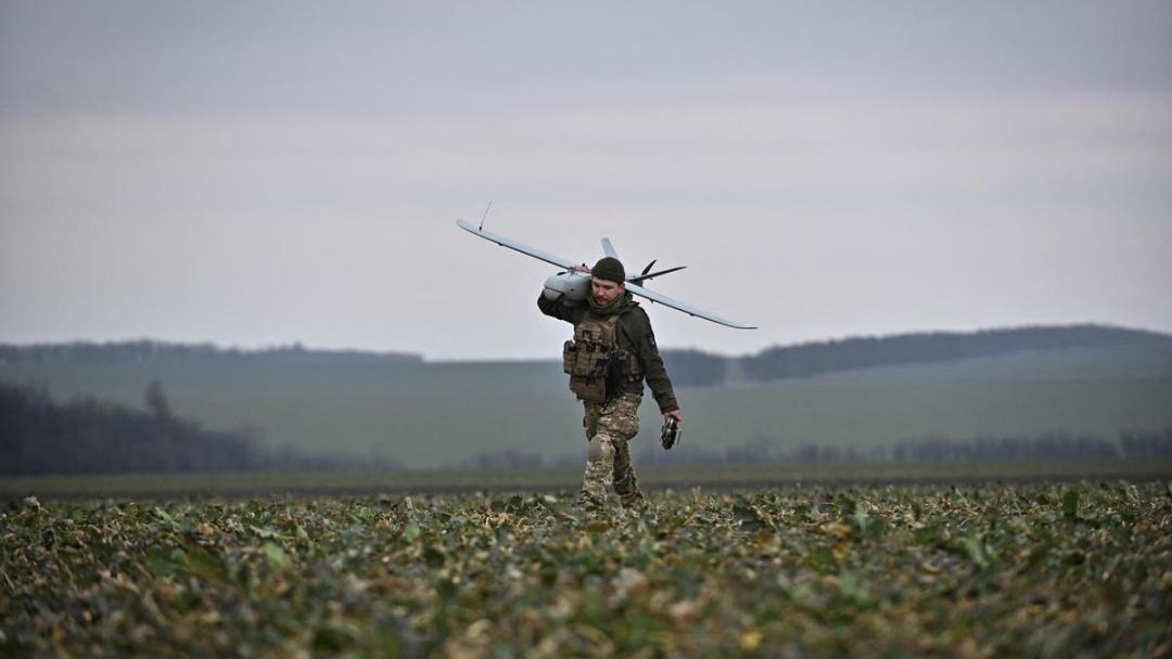 A Ukrainian serviceman carries a Leleka reconnaissance unmanned aerial vehicle (UAV) after it flew at a front line, amid Russia's attack on Ukraine, in Zaporizhzhia region, Ukraine February 15, 2024.