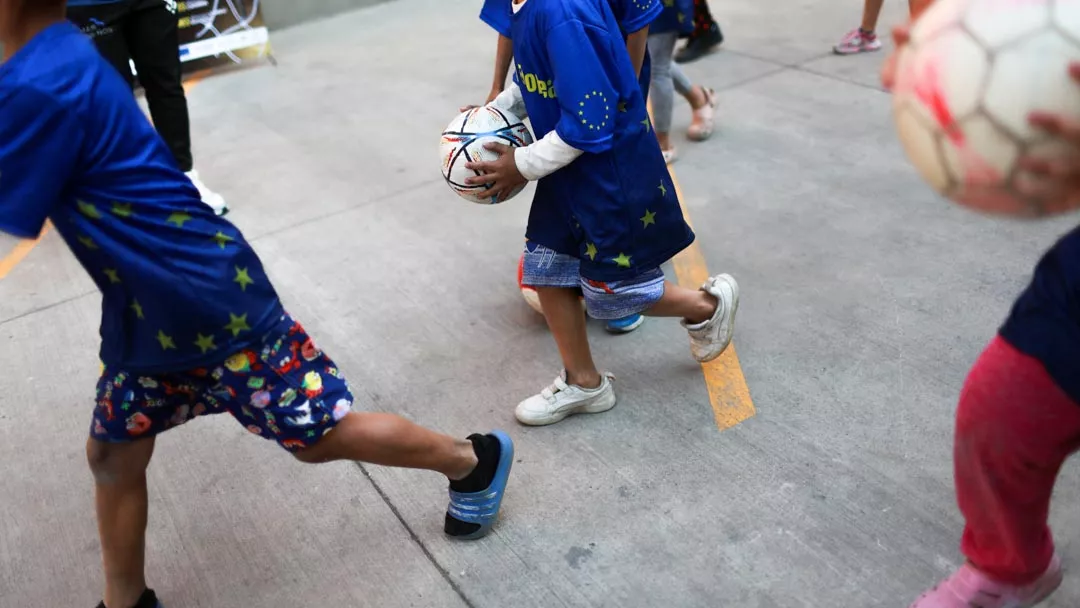 Migrant children train for an April football tournament as part of the EU‑backed “Goals for Inclusion” project, which uses the sport to foster integration, protection and peaceful coexistence among minors facing risks at CAMHU Vasco de Quiroga in Mexico City, Mexico, March, 2026.