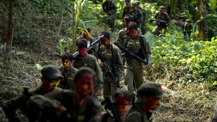 This photo taken on July 30, 2017 shows guerrillas of the New People's Army (NPA) marching in the Sierra Madre mountain range, located east of Manila. Fuelled by one of the world's starkest rich-poor divides, a Maoist rebellion that began months before the first human landed on the moon plods on even though the country now boasts one of the world's fastest-growing economies. Noel CELIS / AFP