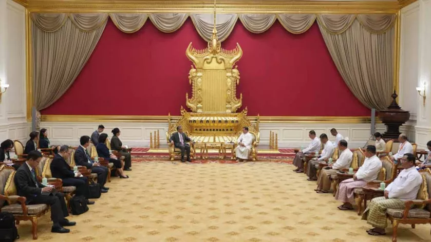 Nay Pyi Taw, April 25, 2026 (Xinhua) -- Myanmar's new President U Min Aung Hlaing meets with Wang Yi, a member of the Political Bureau of the Communist Party of China Central Committee and Chinese foreign minister, in Nay Pyi Taw, Myanmar, April 25, 2026. (Xinhua/Li Guangtao) Li Guangtao / XINHUA / Xinhua via AFP